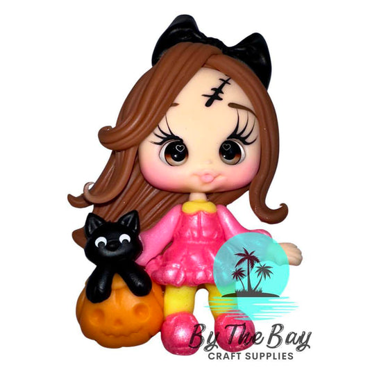 Girl with cat in pumpkin