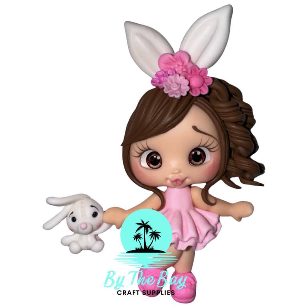 Easter girl with pink dress and little bunny