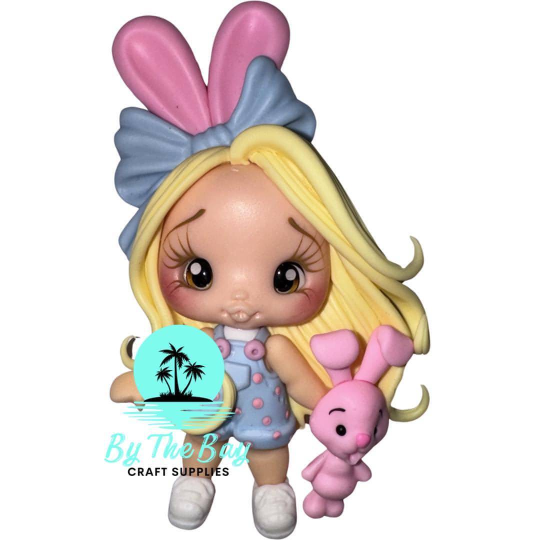 Blonde girl blue overalls pink bunny