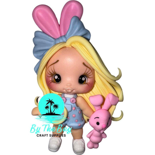 Blonde girl blue overalls pink bunny